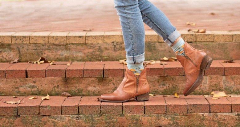 Tan women's boots on brick steps