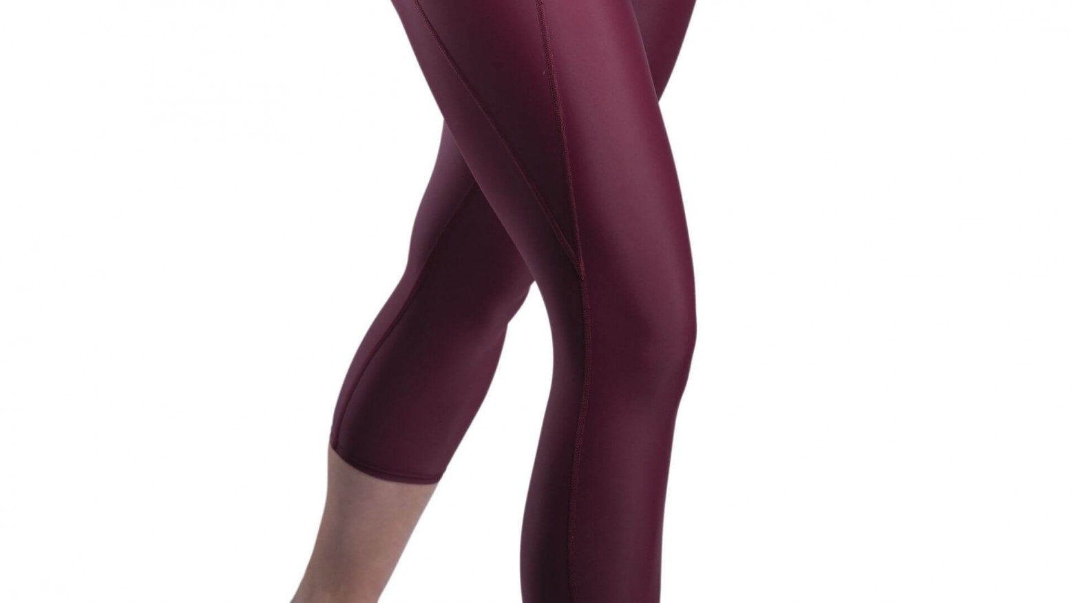 Side view of a woman's knee and legs wearing purple maroon activewear
